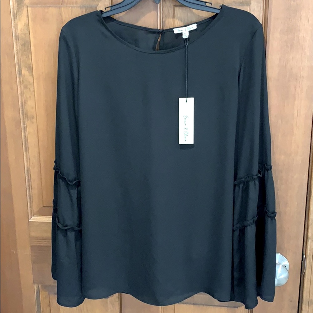 Black blouse with ruffle sleeves. XL- runs small.